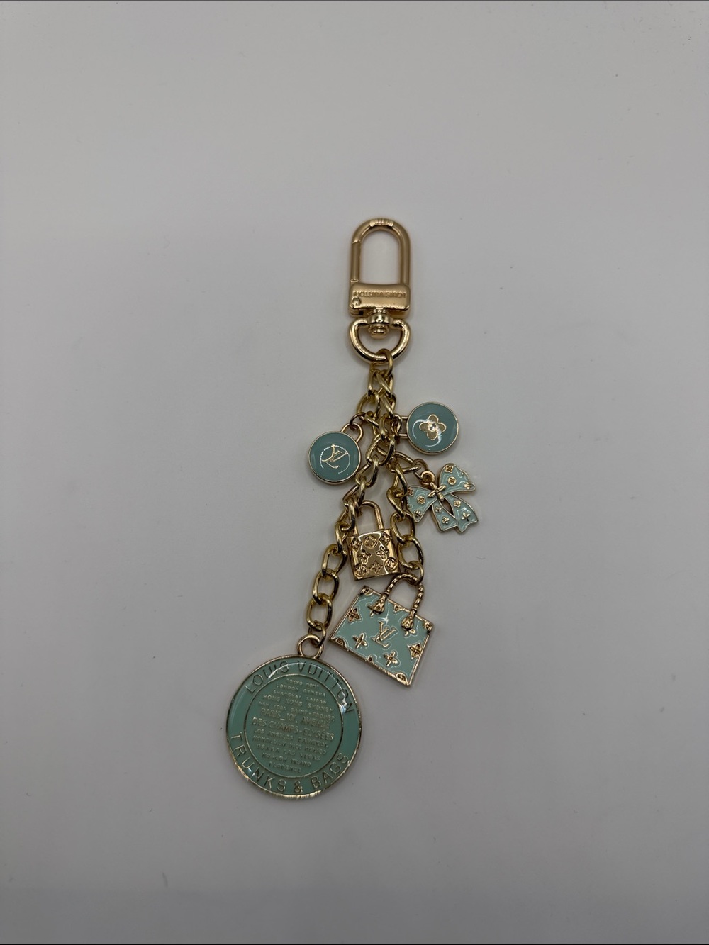 1412. Gold-Tone Aqua Charm Keychain with Bag and Coin Charms